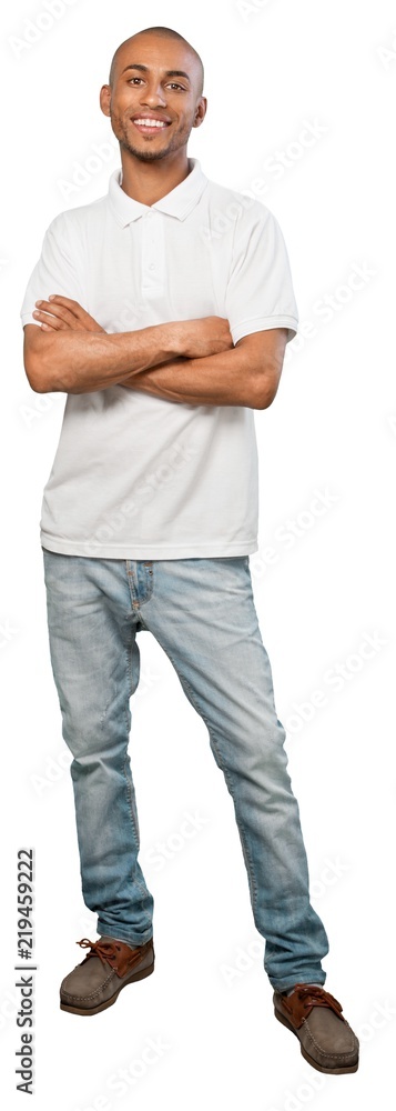 young man standing with arms crossed