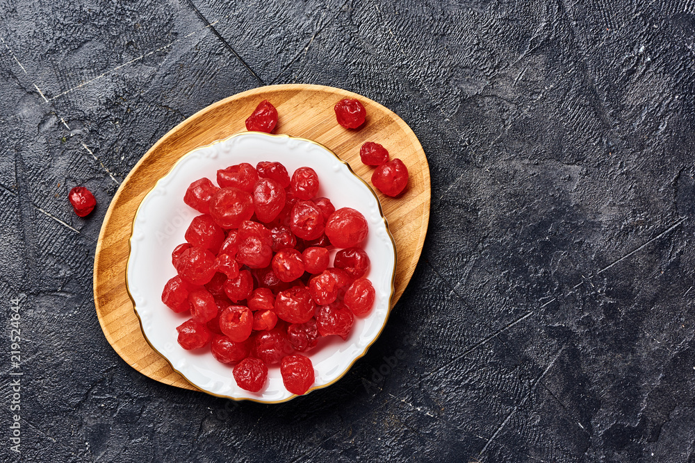 Candied dried cherry on plate. Top view of berries.