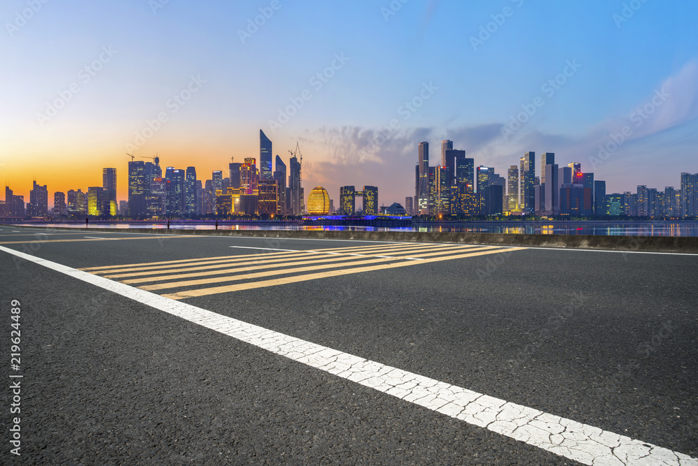 Urban road asphalt pavement and skyline of Hangzhou architectural landscape