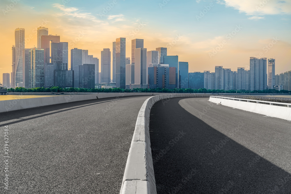 Urban road asphalt pavement and skyline of Hangzhou architectural landscape