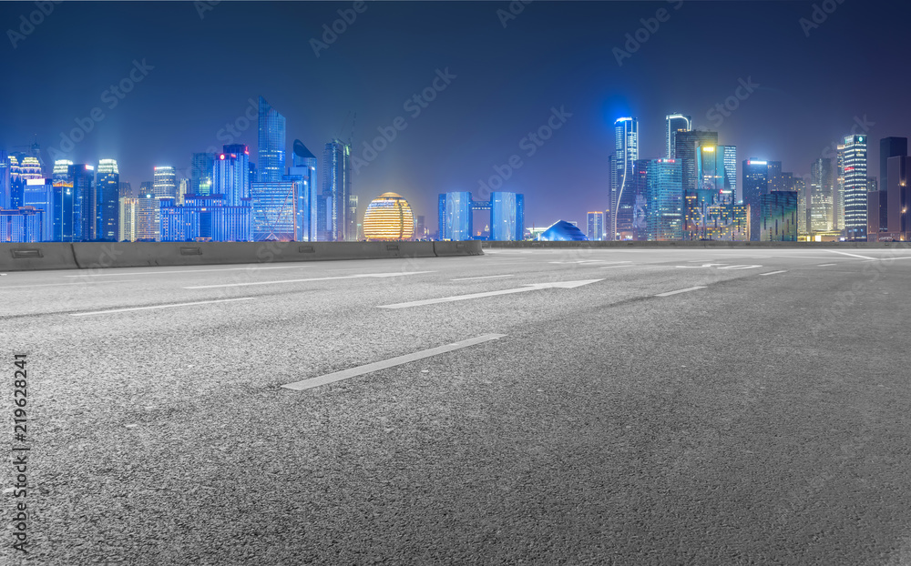 Urban road asphalt pavement and skyline of Hangzhou architectural landscape