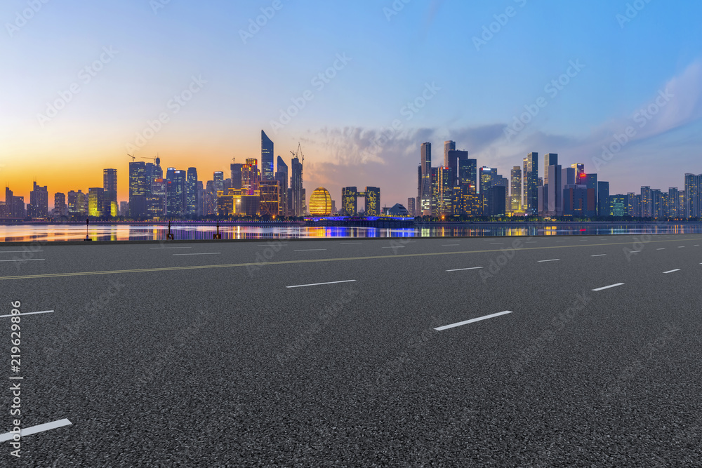 Urban road asphalt pavement and skyline of Hangzhou architectural landscape