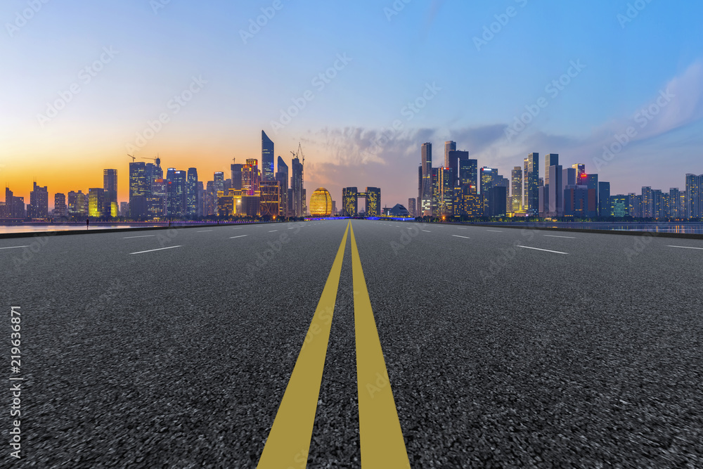 Urban road asphalt pavement and skyline of Hangzhou architectural landscape