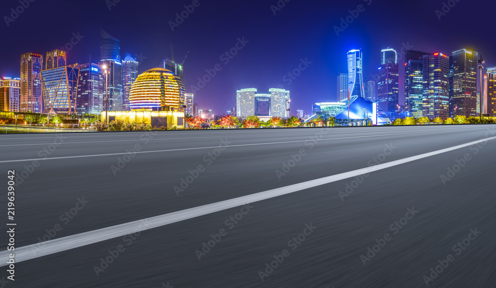 Urban road asphalt pavement and skyline of Hangzhou architectural landscape