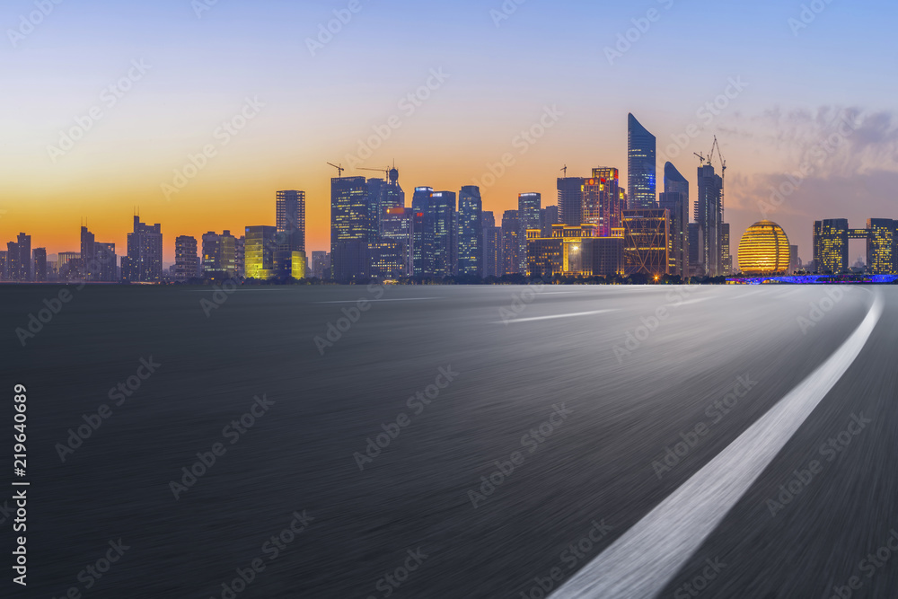 Urban road asphalt pavement and skyline of Hangzhou architectural landscape