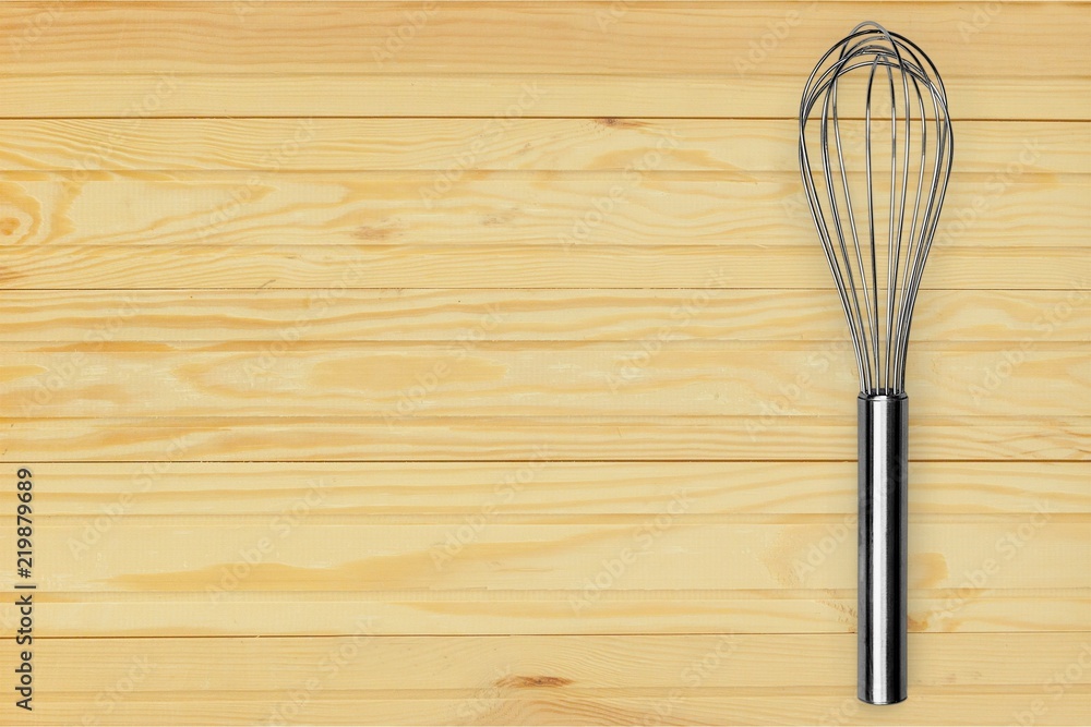 Stainless steel whisk isolated