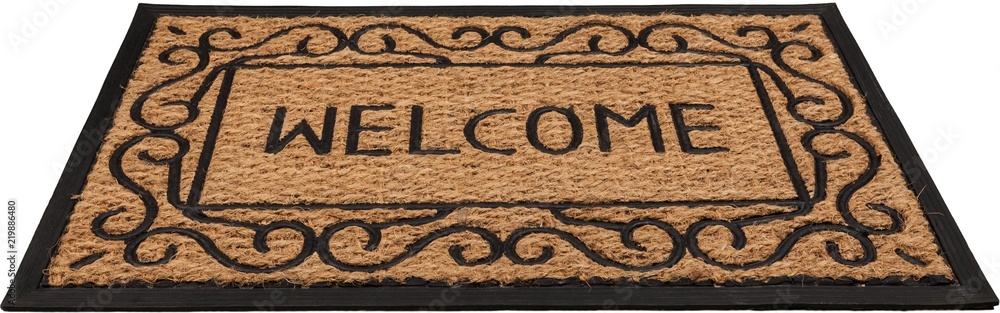 New welcome doormat on wooden floor