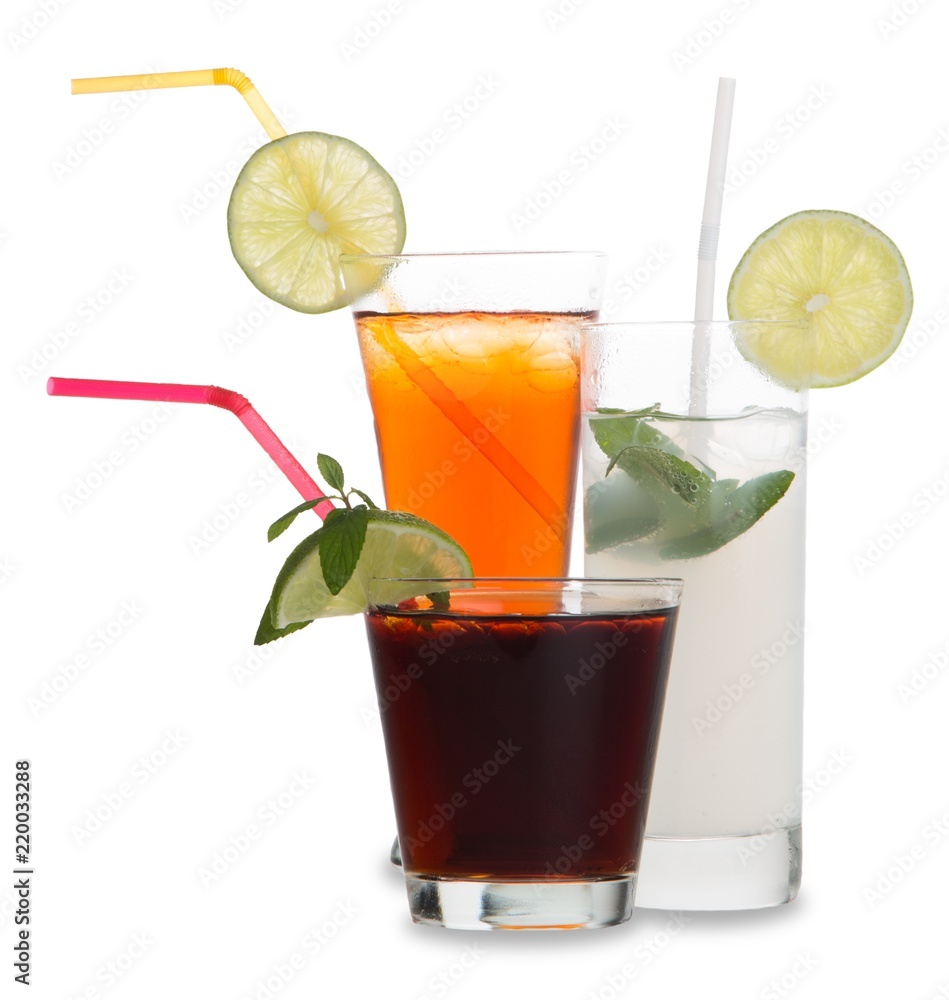 Various Drinks With Straws, Limes And Mint Leaves