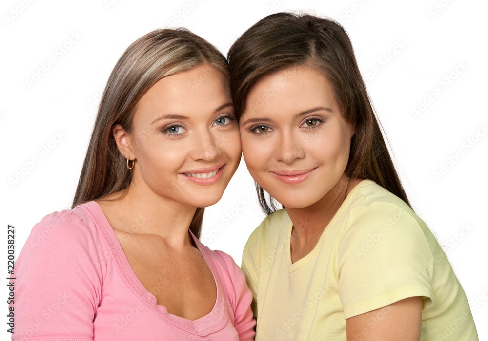 Portrait of Two Smiling Girlfriends / Sisters