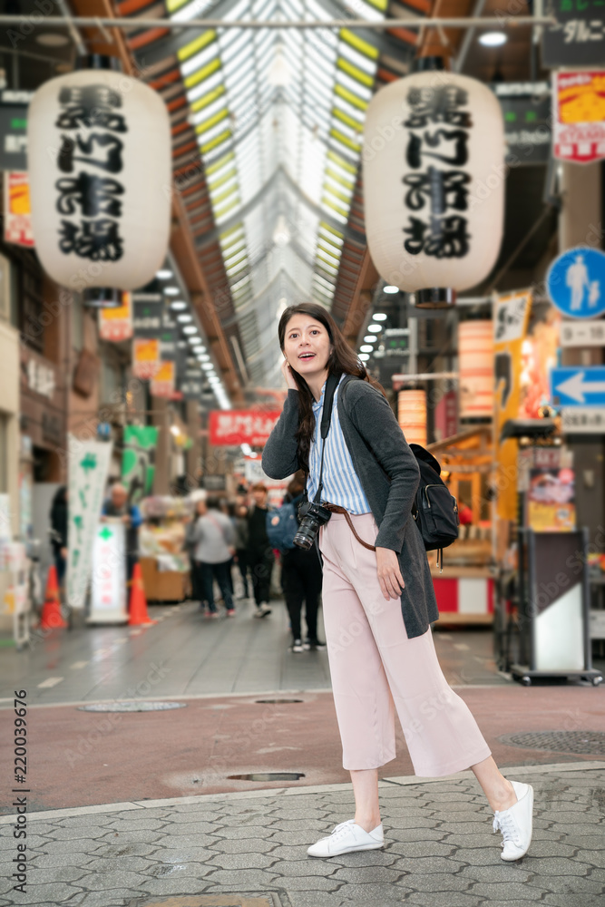 asian woman feeling excited visiting the market.