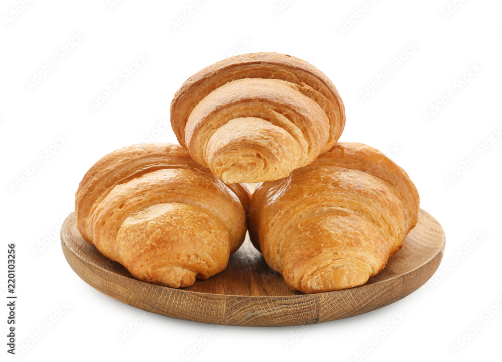 Plate with tasty croissants on white background