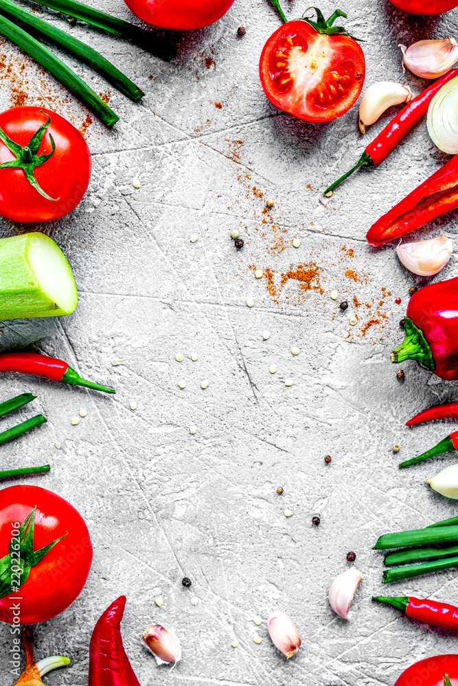 cooking vegetables on the stone background top view