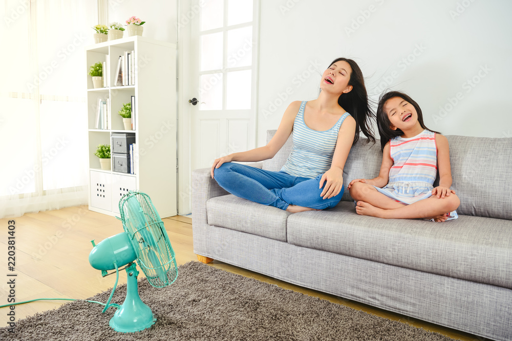 mom and child feeling relief from hot weather.