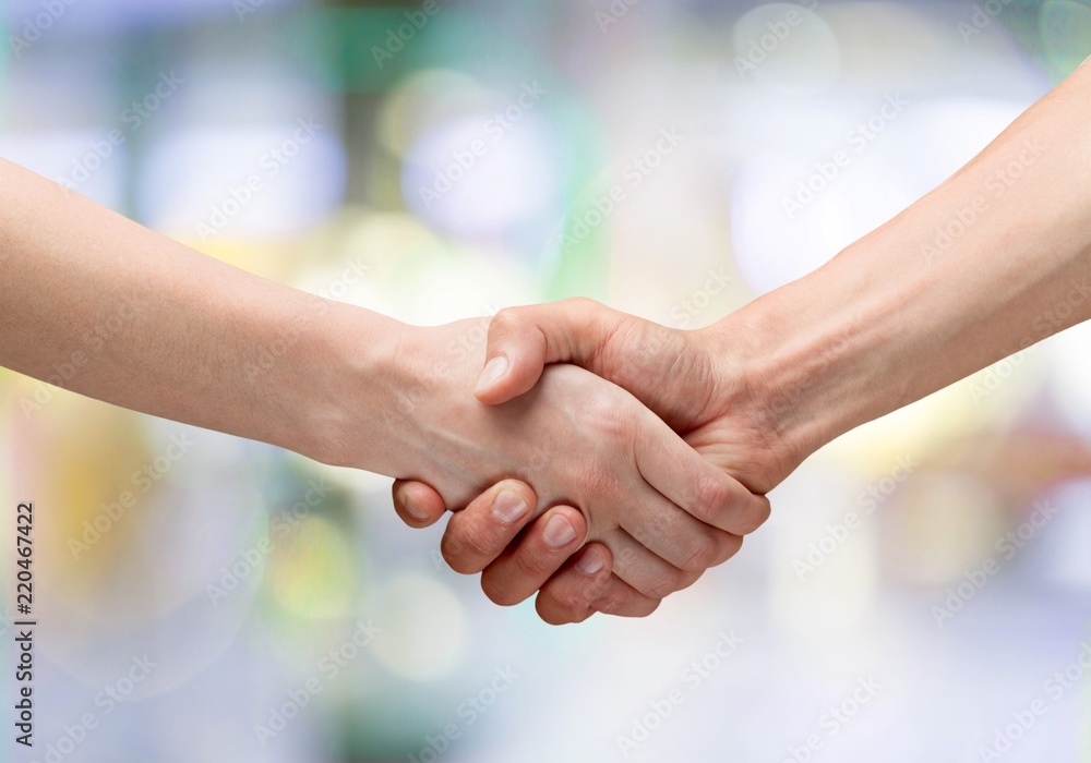 Business handshake of business people on background