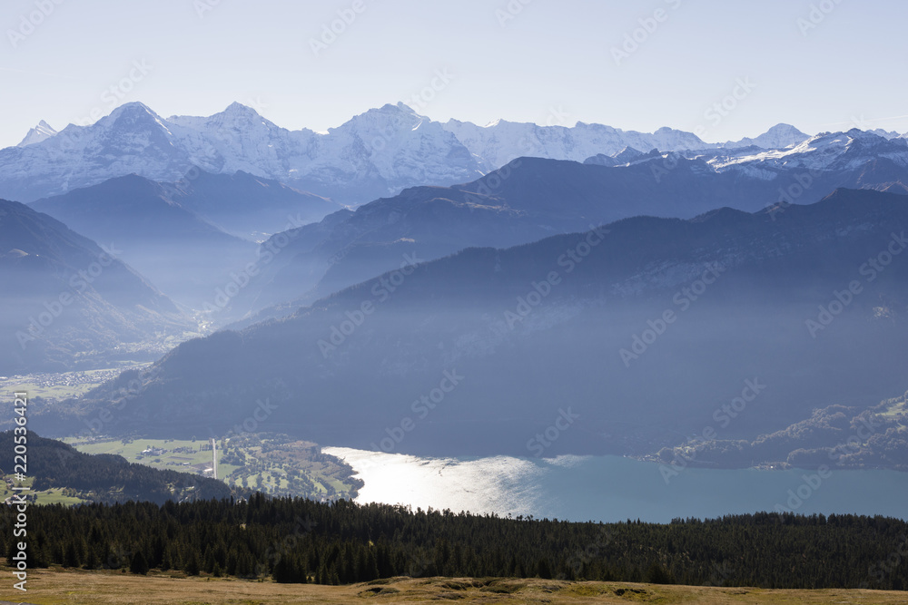 Alps in Switzerland with Eiger, Moench, Jungfrau and Lake Thun on a nice autumn day