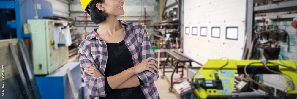 Composite image of female architect standing with arms crossed