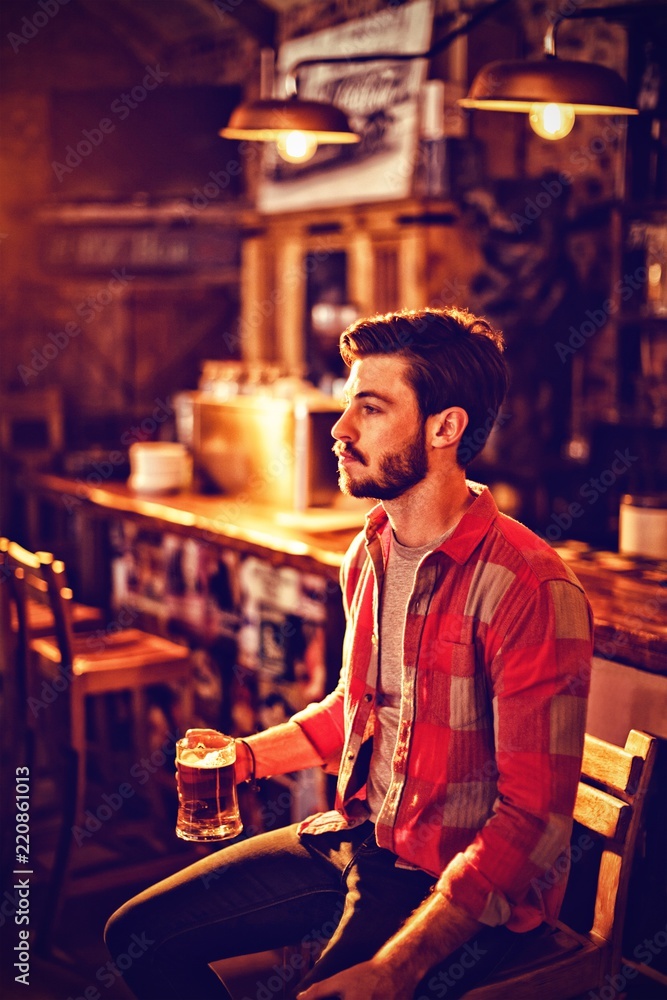 Thoughtful man having beer