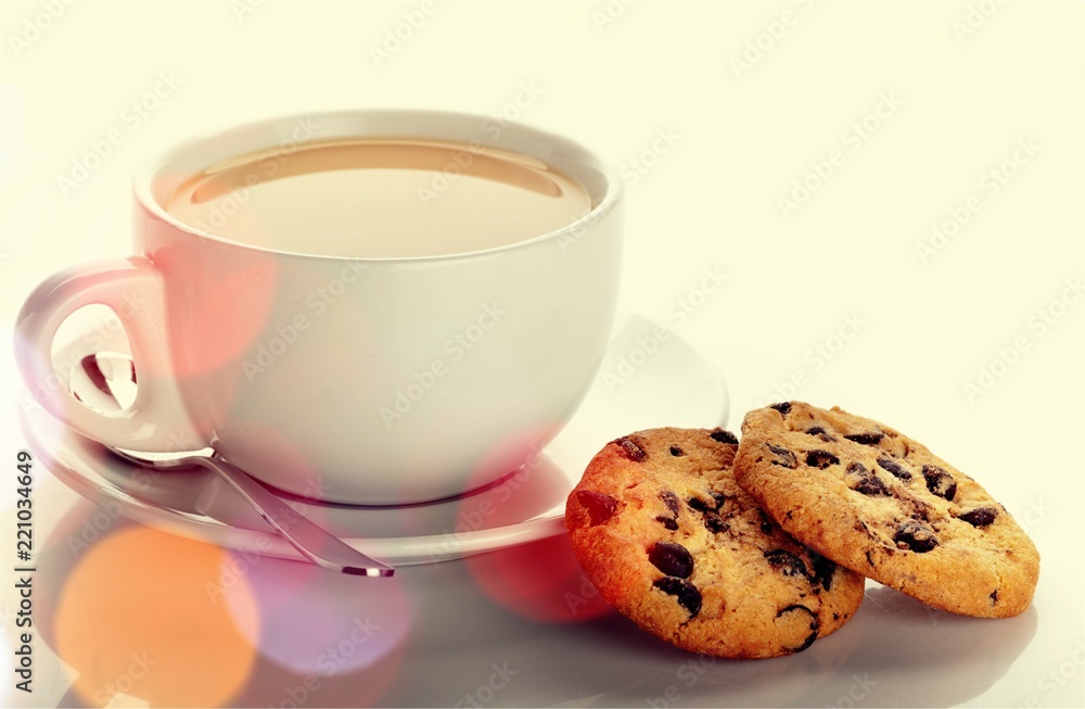 Cup of tea with cookies over  background