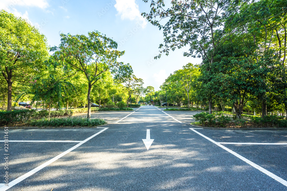 empty asphalt road with city skyline