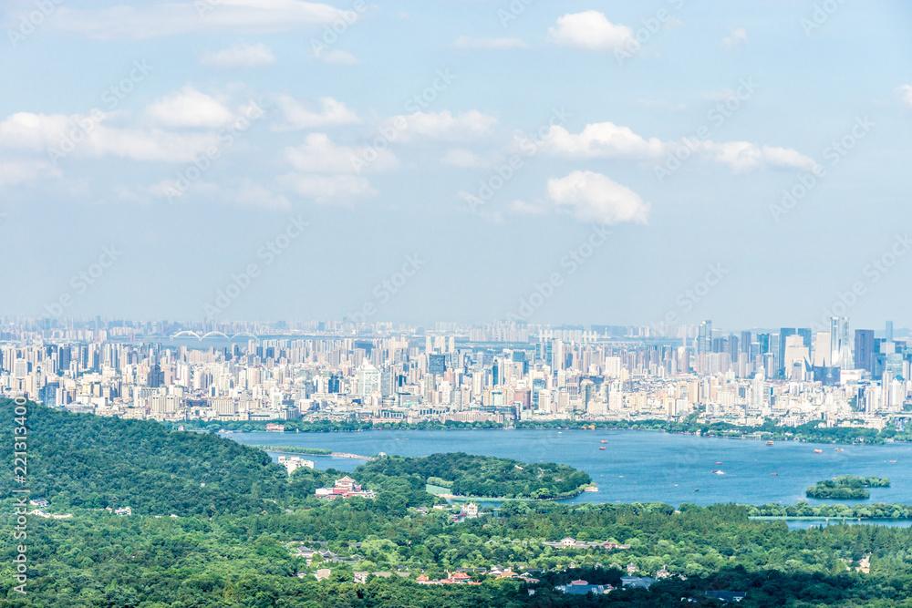 landscape of west lake with hangzhou city skyline