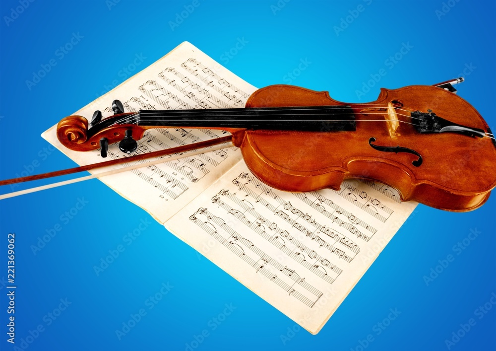 Close-up Photo Of Violin And Musical Notes