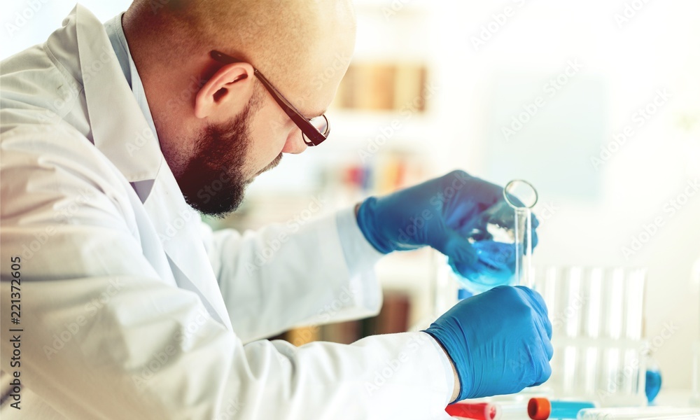 Man researcher carrying out scientific research.