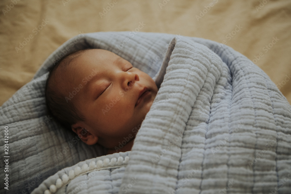 Infant baby fast asleep on the bed