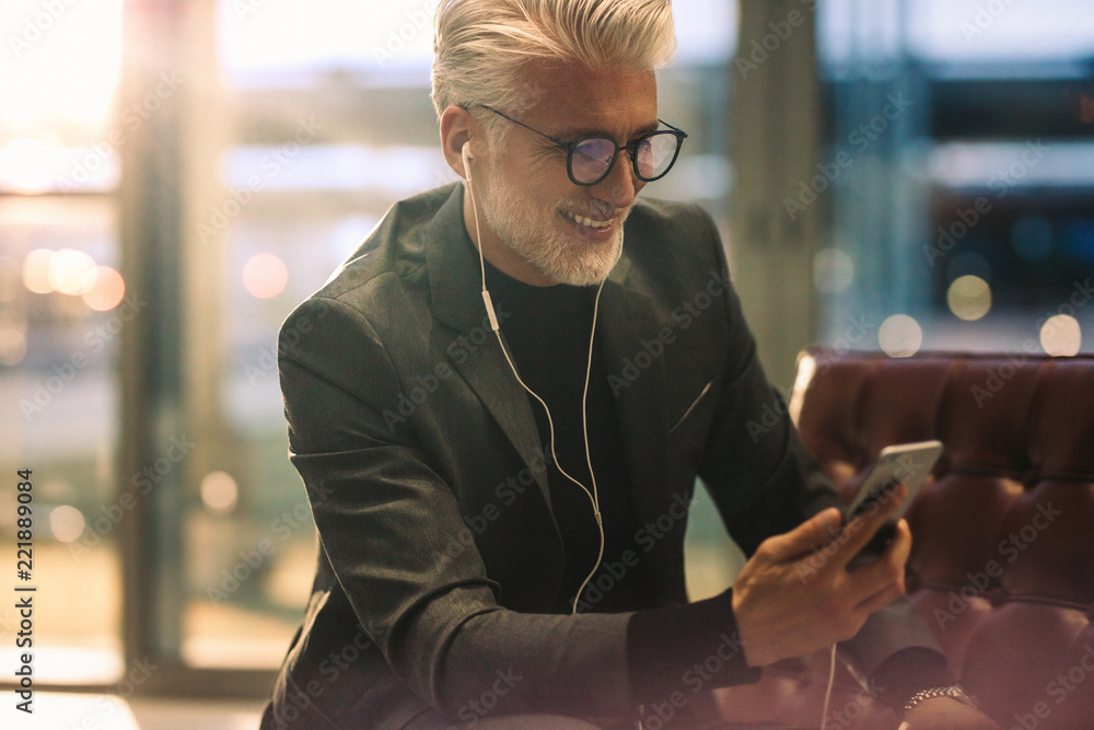 Businessman making video call in office lobby