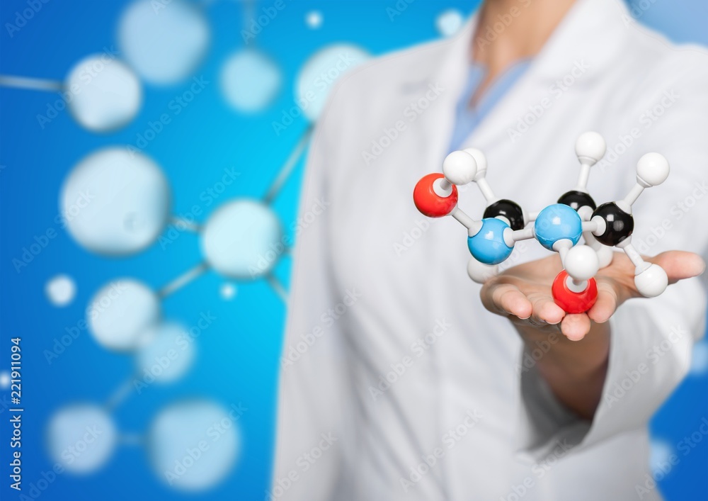 Close up of Molecular structure model in hand on background