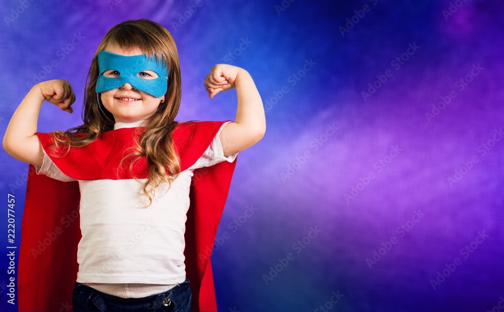 Beautiful little girl in superhero