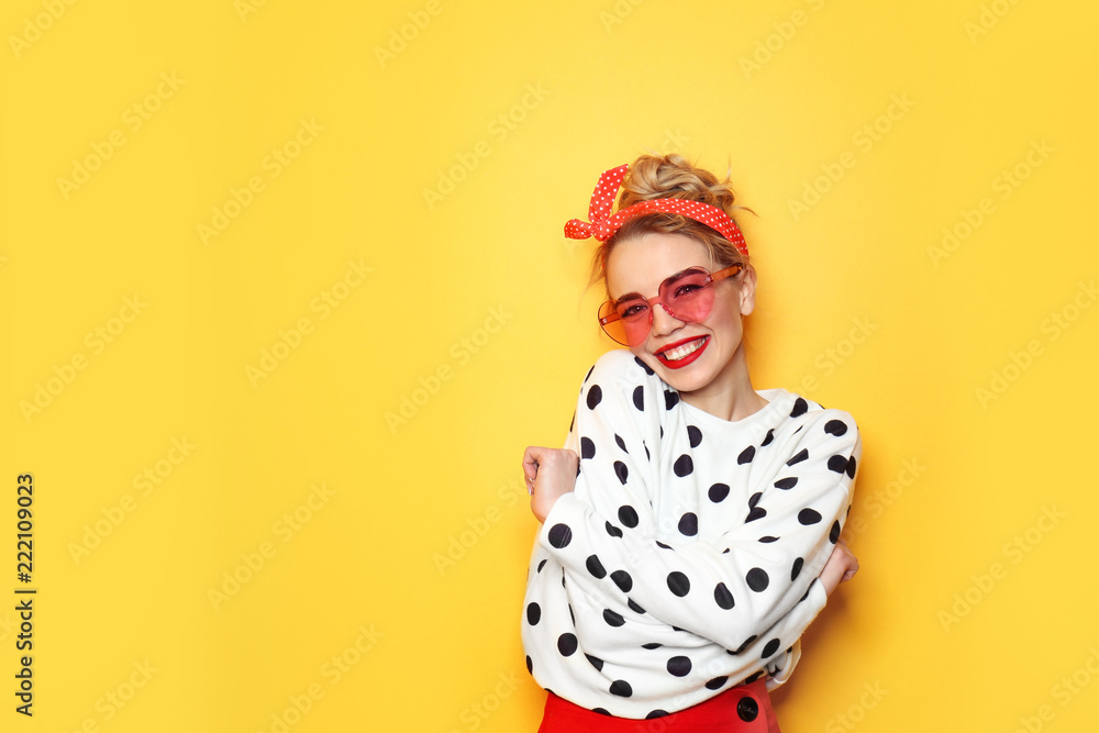 Portrait of beautiful young woman on color background