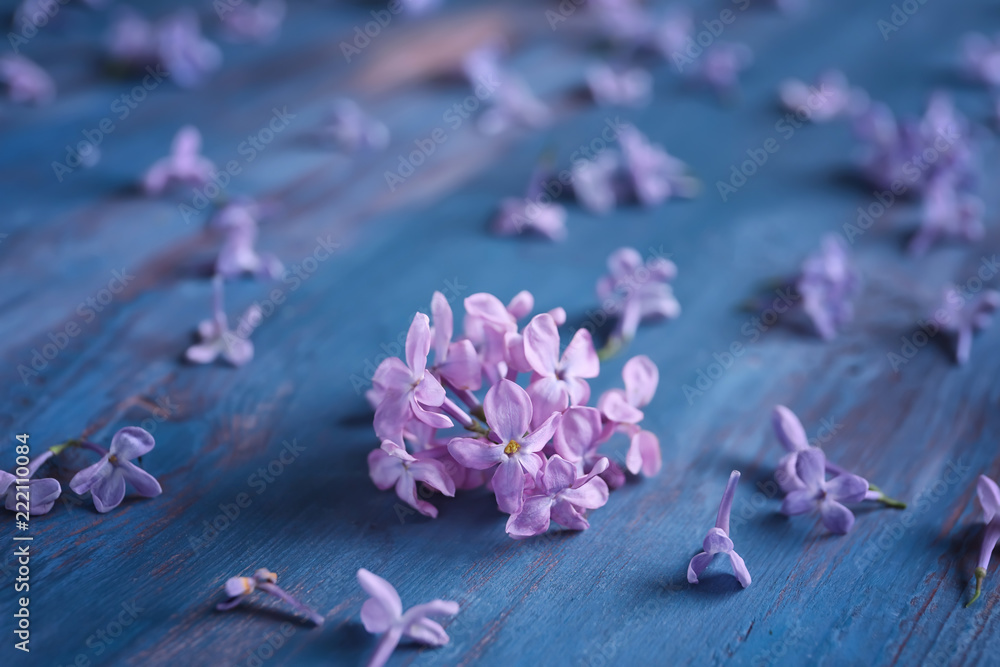 Beautiful blossoming lilac on wooden background