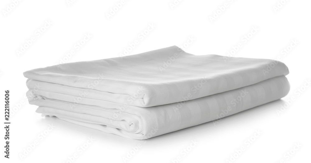 Stack of clean bed sheets on white background