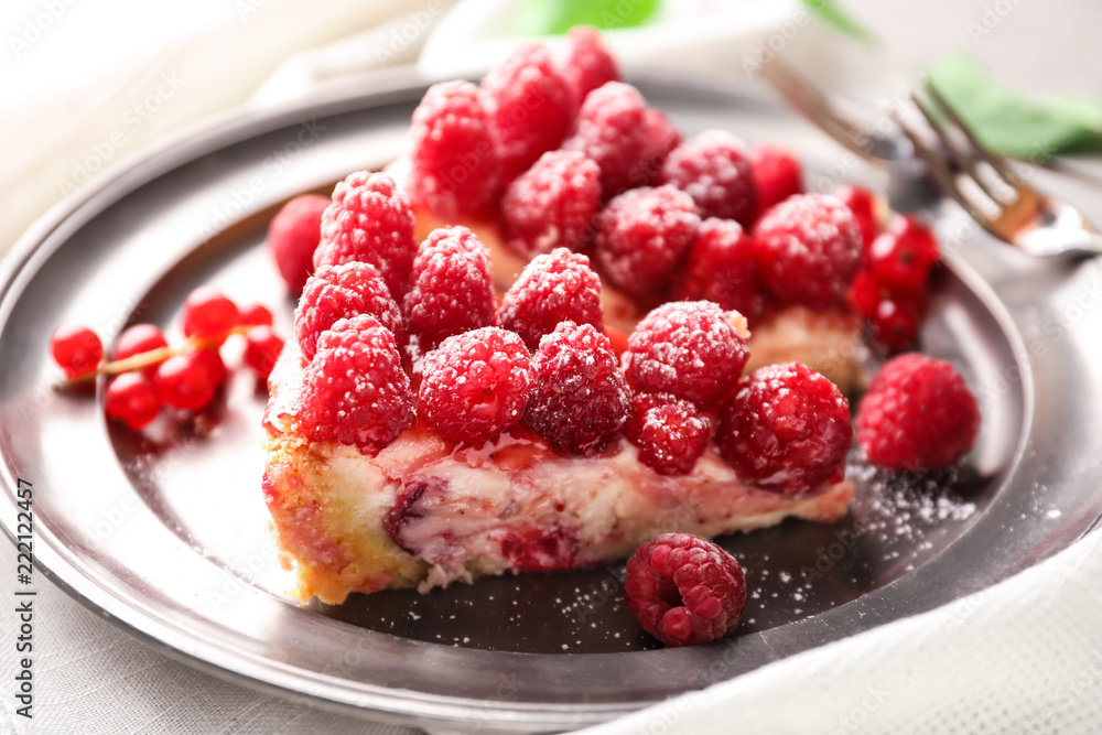 Pieces of delicious raspberry cheesecake on plate, closeup