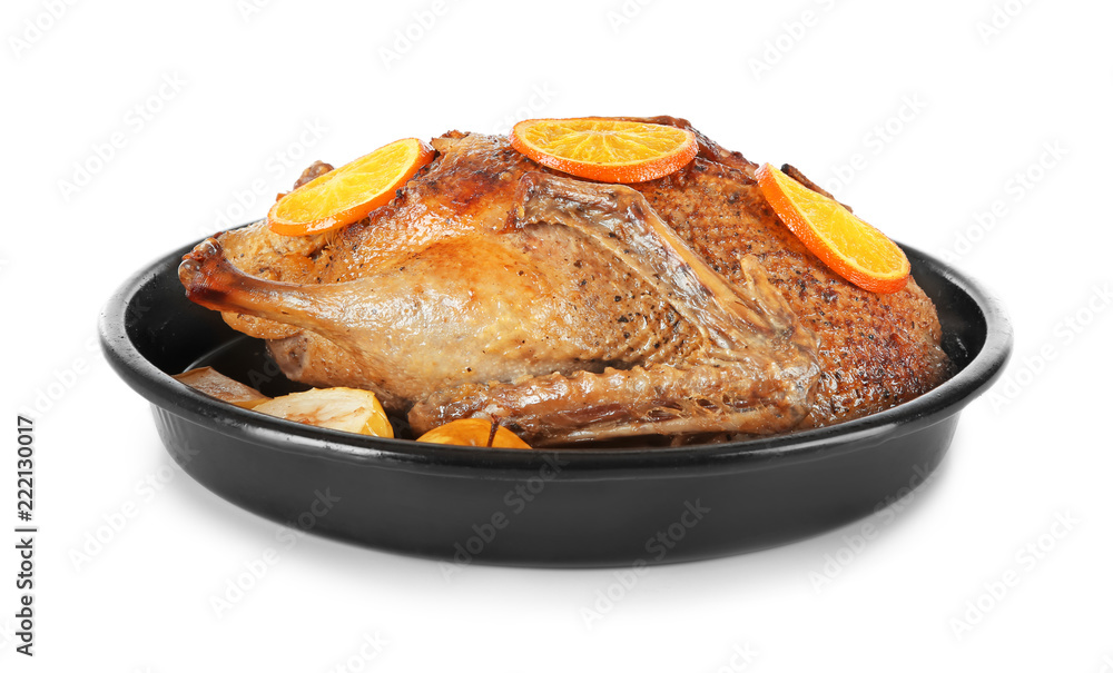 Tasty roasted duck with oranges for Christmas dinner on white background