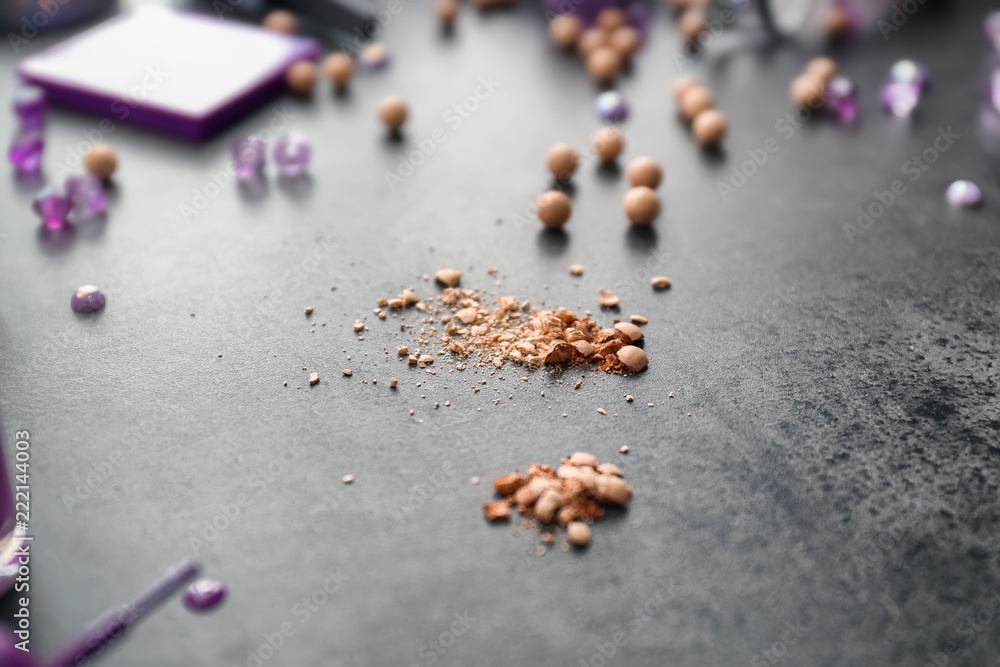 Crumbled powder on grey table