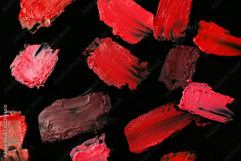 Strokes of color lipsticks on dark background