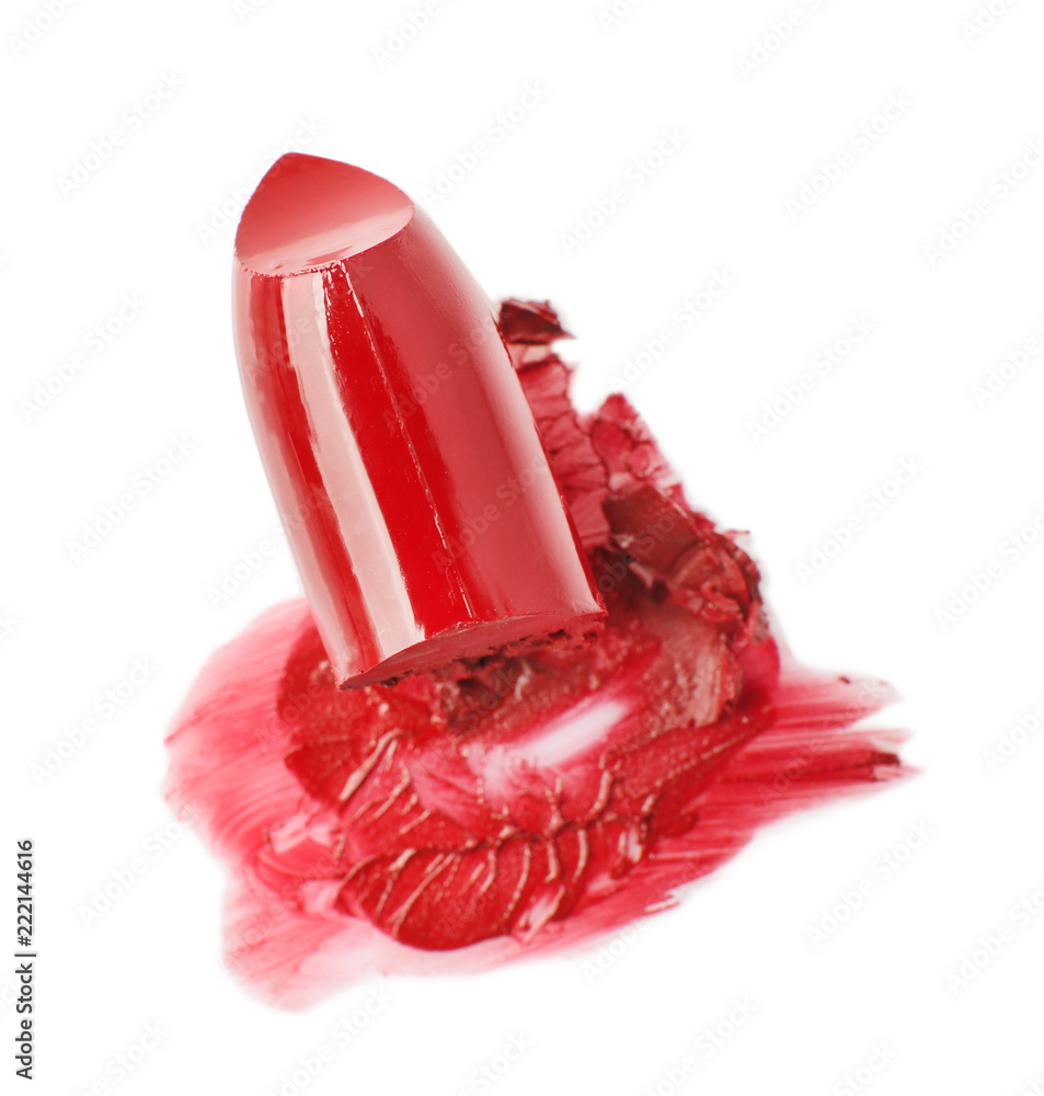 Broken red lipstick on white background