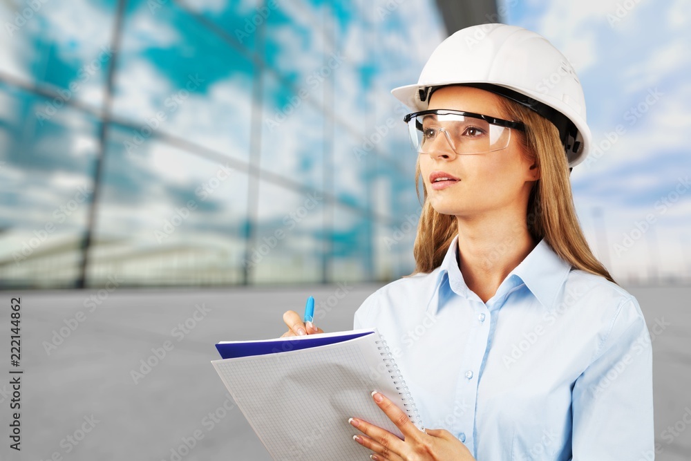 Beautiful woman engineer  with document