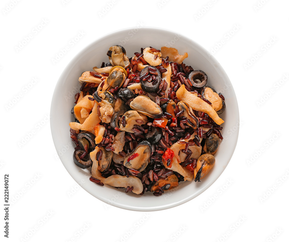 Bowl with tasty boiled rice and seafood on white background