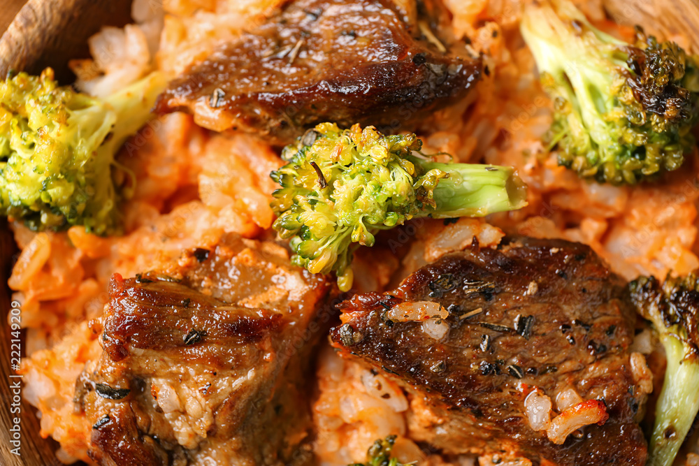 Boiled rice with meat and broccoli, closeup