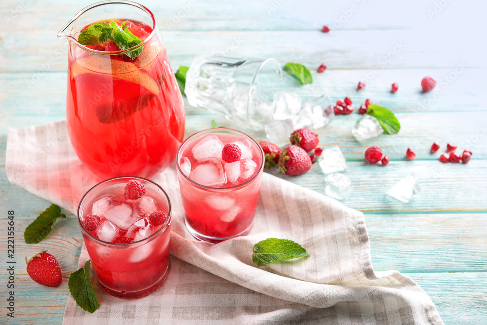 Fresh summer cocktail in glassware on wooden table