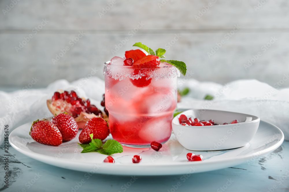 Fresh summer cocktail in glass on plate