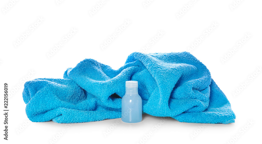 Soft blue towel with cosmetic on white background