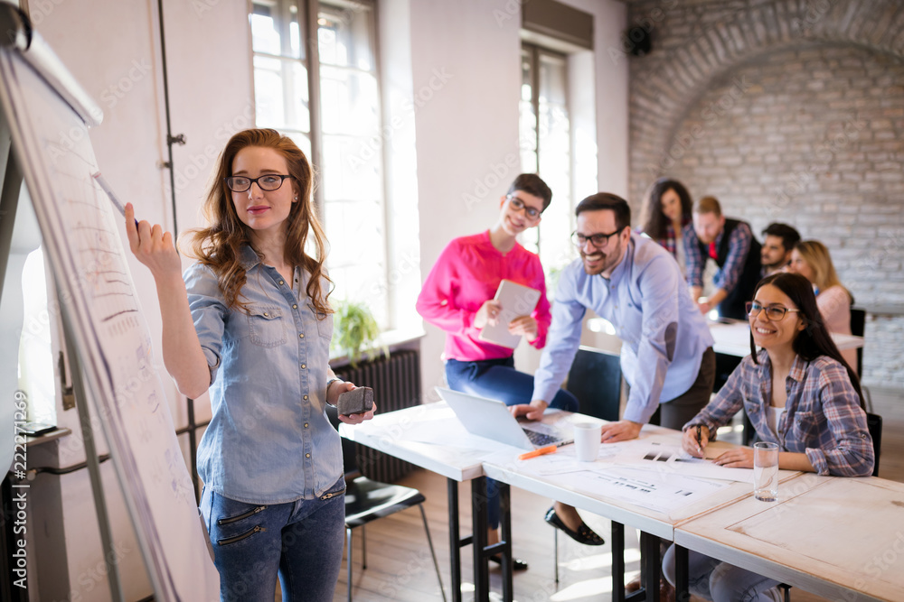 Portrait of young attractive architect doing presentation