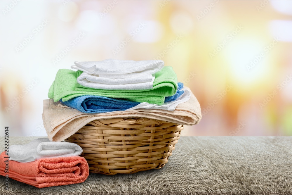 Laundry Basket with colorful towels on desk