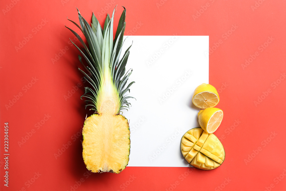 Composition with various delicious exotic fruits and blank card on color background