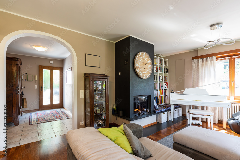 Living room with large sofa and entrance