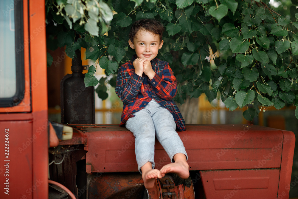 boy sitting on the tractor