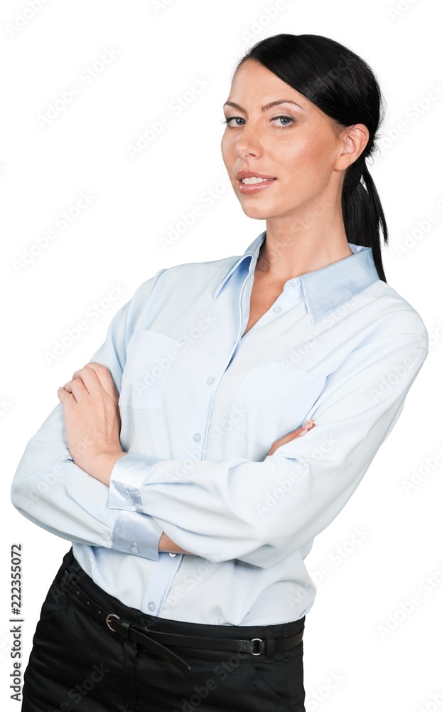 Businesswoman leaning back slightly with her arms crossed